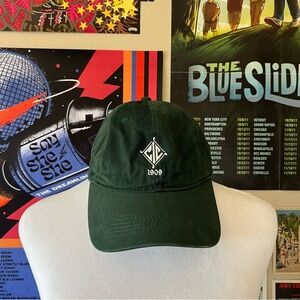 Emerald green hat with white logo